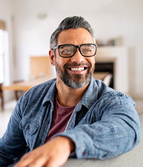 smiling person with glasses